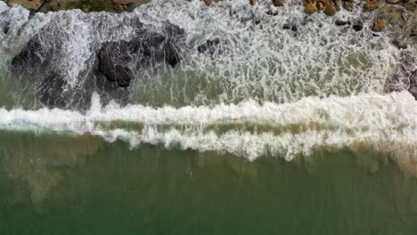 ocean waves crashing on rocky shore