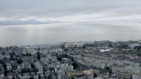 Drone-Aerial-of-the-beautiful-swiss-city-center-of-lausanne-located-on-the-lake-geneva-in-Switzerland-during-winter,-Europe