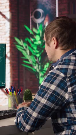 Vertical video Man looks at tutorial on chroma key tablet about AI virtual assistant