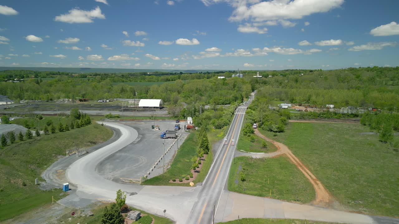 Aerial drone video of a bridge going over a railway.