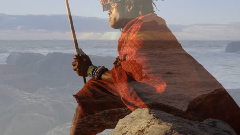 animation of landscape over african american man wearing traditional clothes