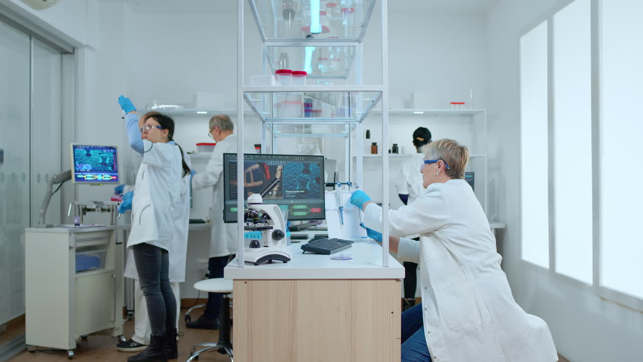 Multiethnic team working in busy laboratory