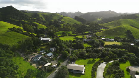 aerial-scenic-natural-landscape-footage-of-green-hills-scenario-in-New-Zealand-Ngunguru,-north-island