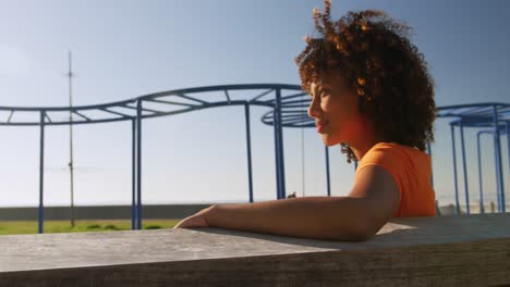 woman looking away and smiling in a park