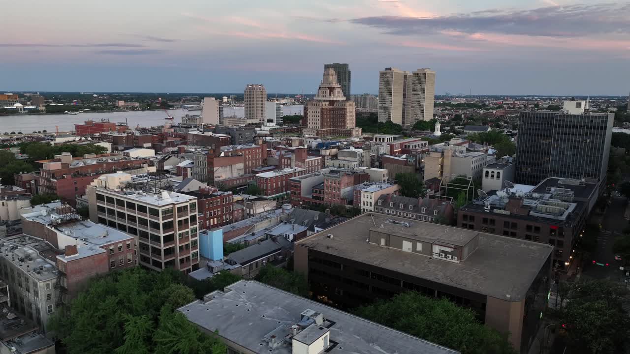 Aerial establishing shot of American town in Connecticut. Albany downtown with river st dusk. Historic towers and buildings in center. Houses and homes in center of city