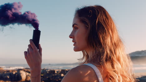 woman-looking-at-purple-smoke-bomb-with-curiosity-on-beach-at-sunrise