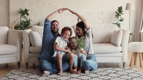 portrait of happy wellbeing homeowners family with little kids