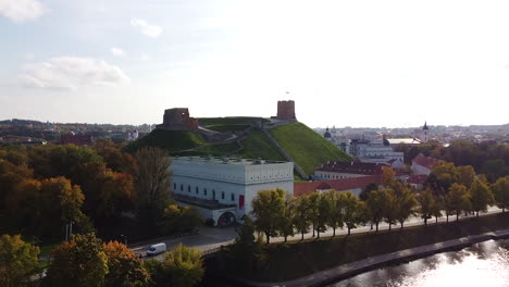 gedimas castle tower and vilnius cityscape on beautiful autumn time, aerial ascend view