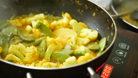 preparing vegetable curry