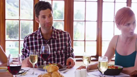 friends interacting while having their meal