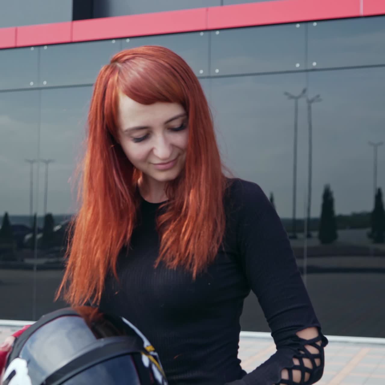 Woman sitting on motorcycle