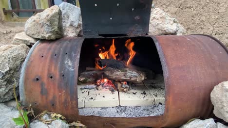 Handmade-Fireplace-Burning-Wood-Sticks-in-a-Survival-Campfire-Cottage-in-Stunning-Nature-in-Iran-Forests