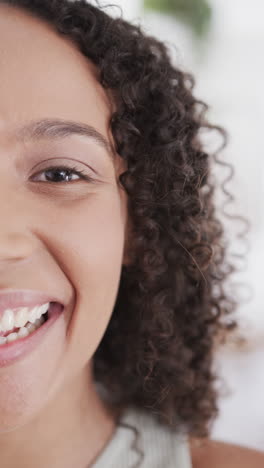 vertical video of portrait of happy biracial woman having video call in slow motion