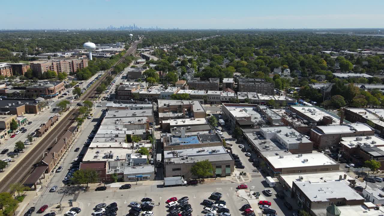 La Grange, IL on a sunny fall day, showcasing streets, buildings, and the suburban landscape With Downtown Chicago in Background. Orbit Right Day E