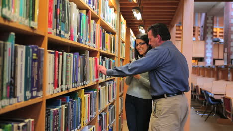 woman and man finding a book