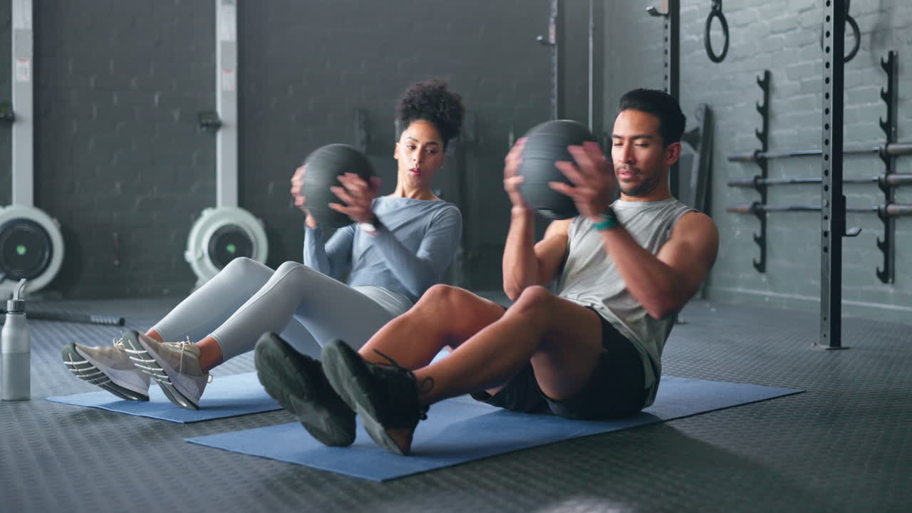 Fitness, medicine ball and friends on gym floor