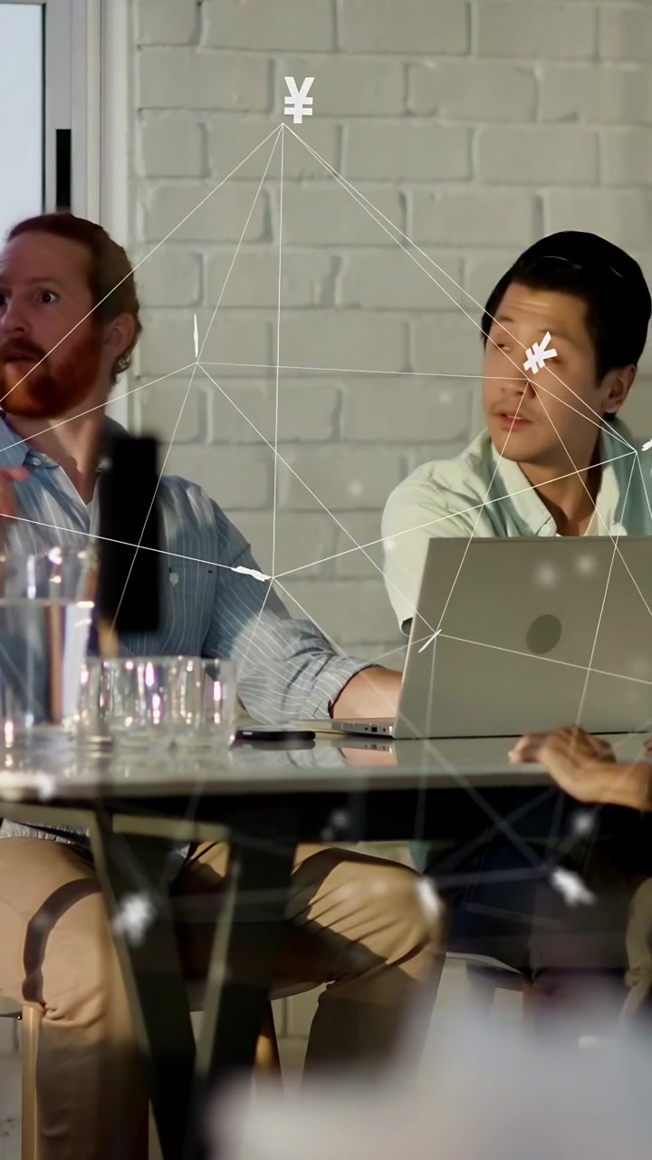 Vertical video: Host handing tablet two seated leaning pointing laptop with overlay for UX review