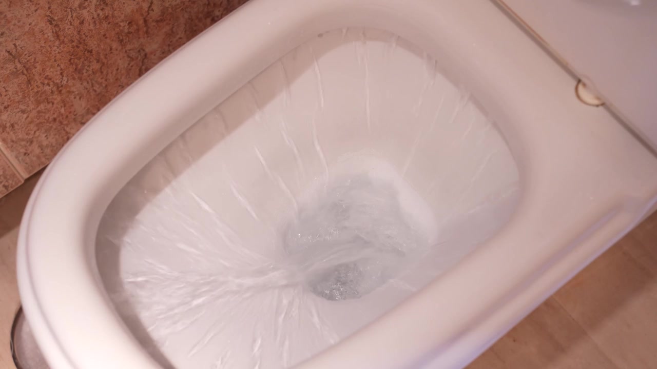 The toilet flush sequence with various water levels in modern sanitary fixtures and facilities