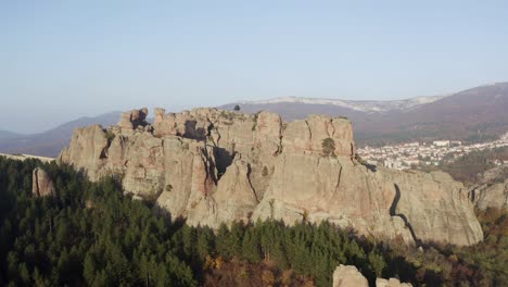 strafing an aerial drone shot of the sculptural rock formations of belogradchik cliffs, a natural fortress at the foothills of the balkan mountain ranges, in the provinve of vidin in bulgaria