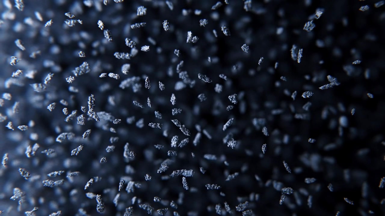 Avvio dei fotogrammi, una nuvola di polvere che si sposta e ruota mettendo a fuoco in un bordo blu macro, messa a fuoco morbida, nero.