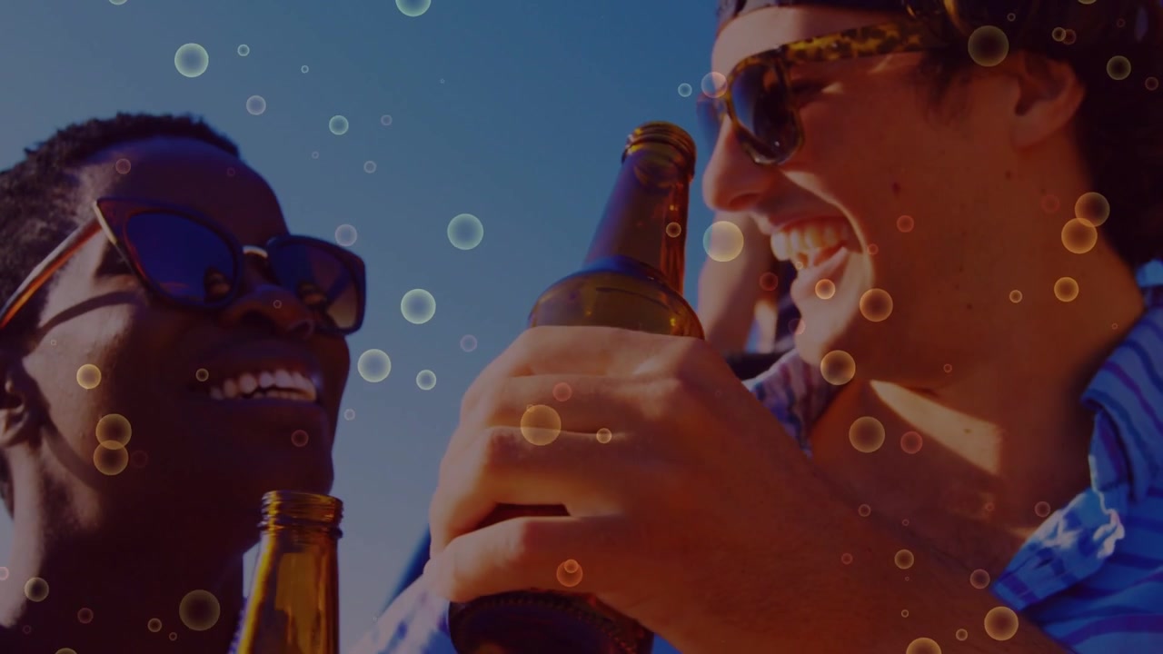 Front duo clinking bottles, toasting on boat deck for travel ad, bubble overlay floating