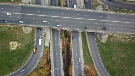 Transport junction in autumn, top view from drone point of view. Drone flying up