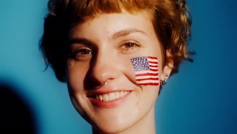 woman with american flag painted on face