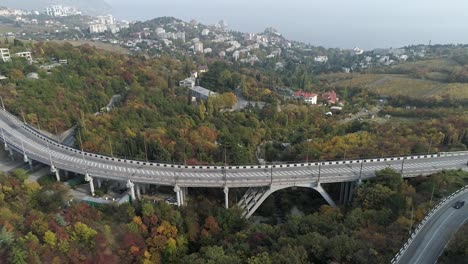 mountain highway bridge with autumn foliage