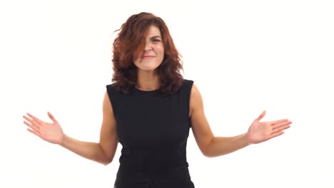 Displeased-upset-young-woman-waving-her-arms-in-a-mad-gesture-and-looking-in-the-camera-isolated-on-white-background