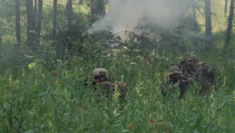 soldiers going through jungle debris