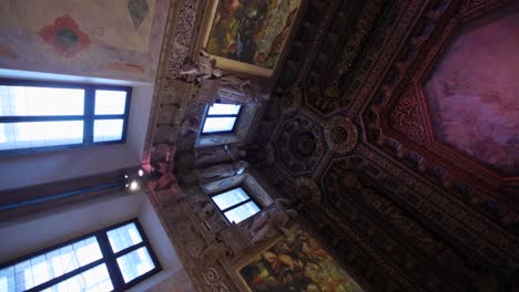 vertical - ancient palace interior with sculpture and artwork in mantua, italy