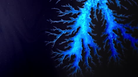 bright blue ink forming intricate patterns and shapes resembling lightning branches on dark background