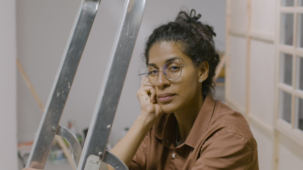 Woman with glasses looking at camera