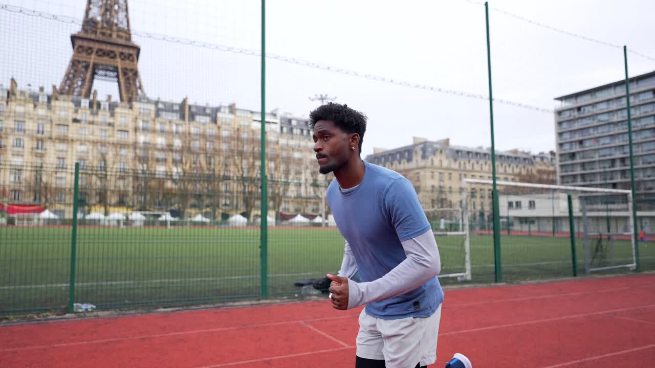Man running near the Eiffel Tower in Paris