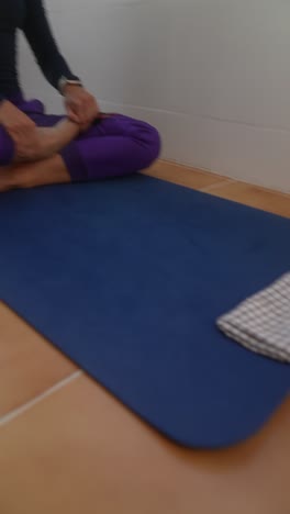 woman practicing yoga in a home environment