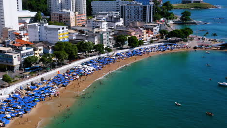 Aerial-view-of-Santa-Maria-Fort,-the-beach,-the-neighborhood,-some-boats-parked-and-the-Farol-da-Barra-at-background,-Salvador,-Bahia,-Brazil