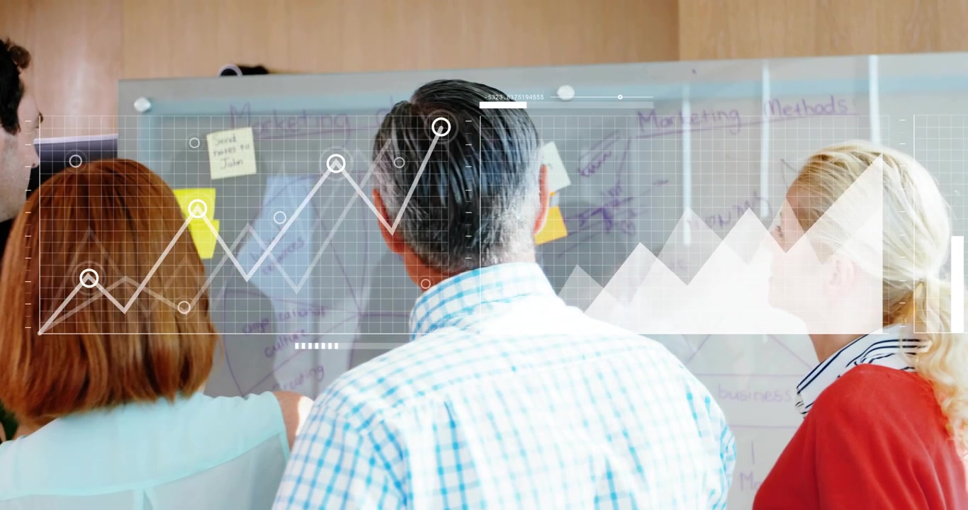 Senior manager repositioning note, initiating data charts overlaying marketing board for insights