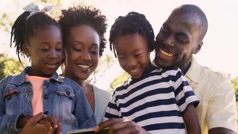 family is taking selfie in the park