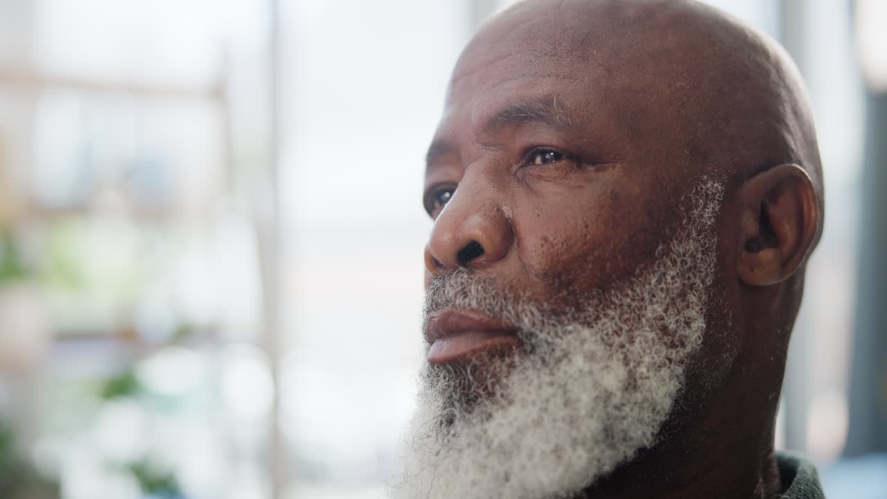 Close-up portrait of a thoughtful senior man