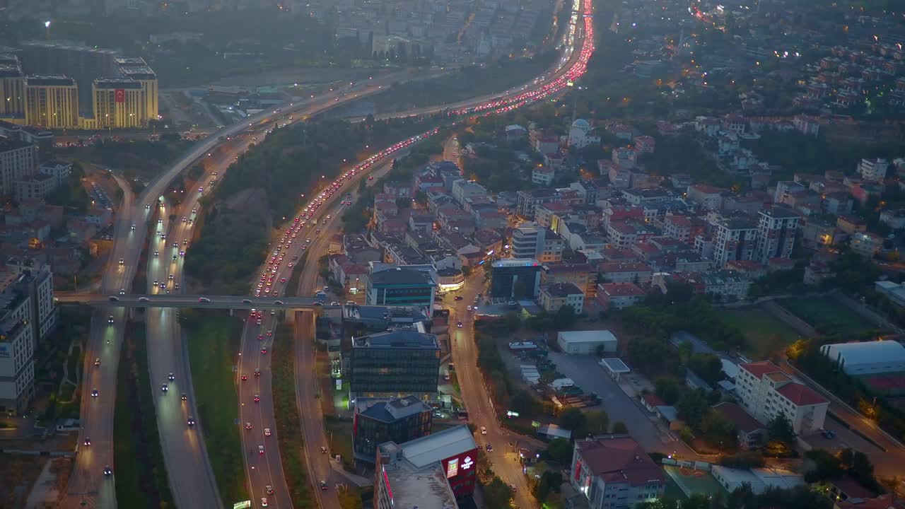 Aerial View of Cityscape with Highway and Traffic