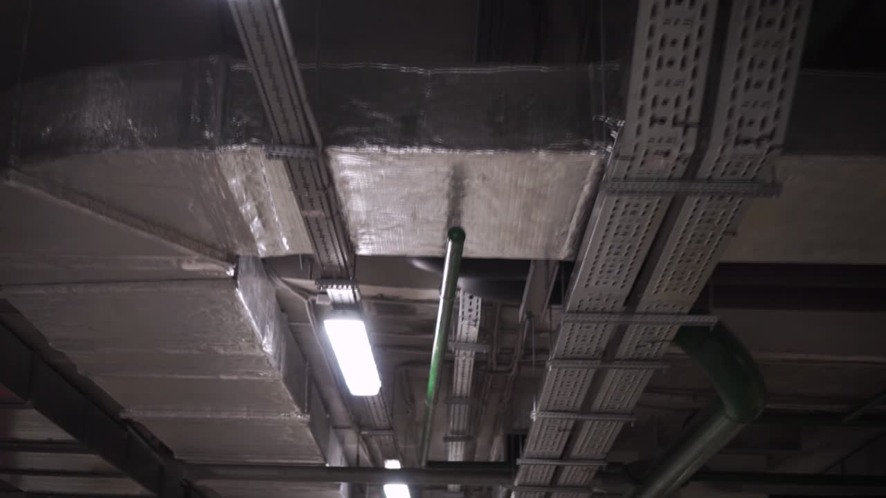 Underground Facility Ceiling with Pipes, Ducts and Electrical Conduits