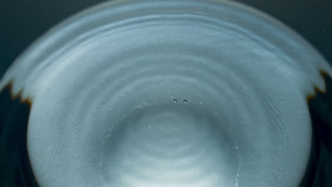 clean water drop falling super slow motion. drink dribble making circle shapes