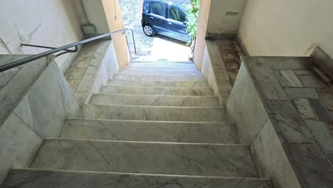 descending stairs to a sunny courtyard