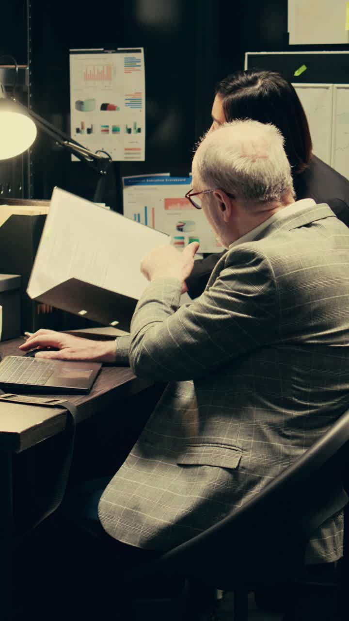 Vertical Video Detective team examines archived files for crucial case evidence