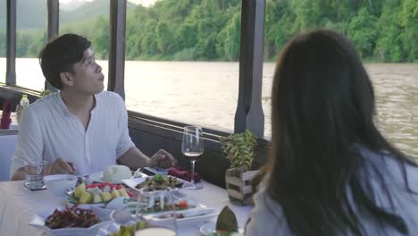 couple on the boat with food and looking view, video in 4k
