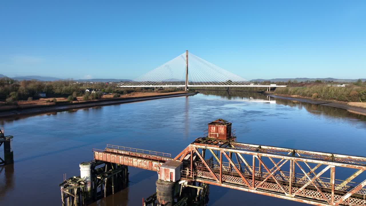 Ireland Epic Locations Waterford drone flying over old railway bridge with modern transport bridge behind