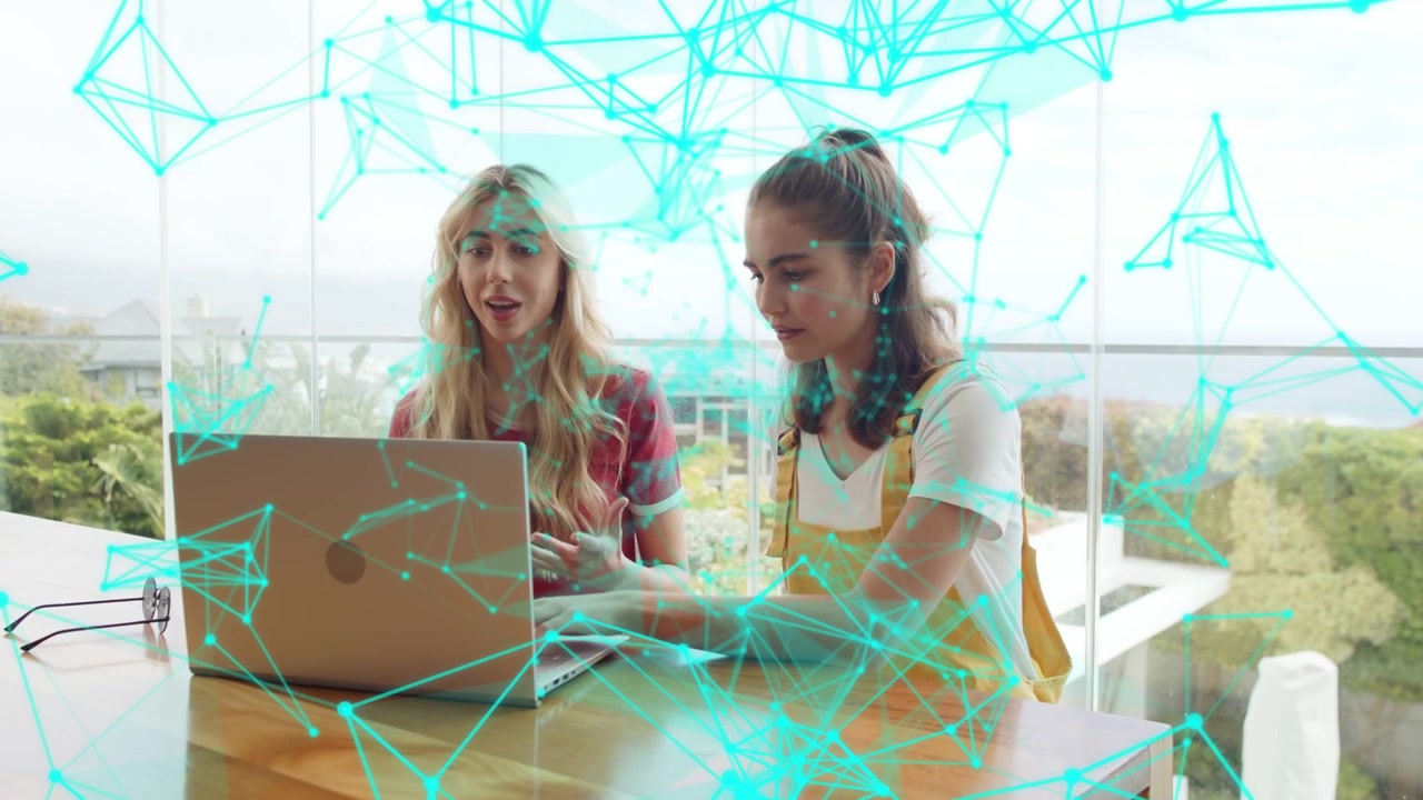 Right woman typing laptop causing teal net overlay drifting over faces while peer talking tech