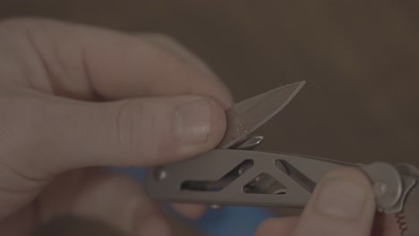 Unfolding-a-knife-from-a-multi-tool