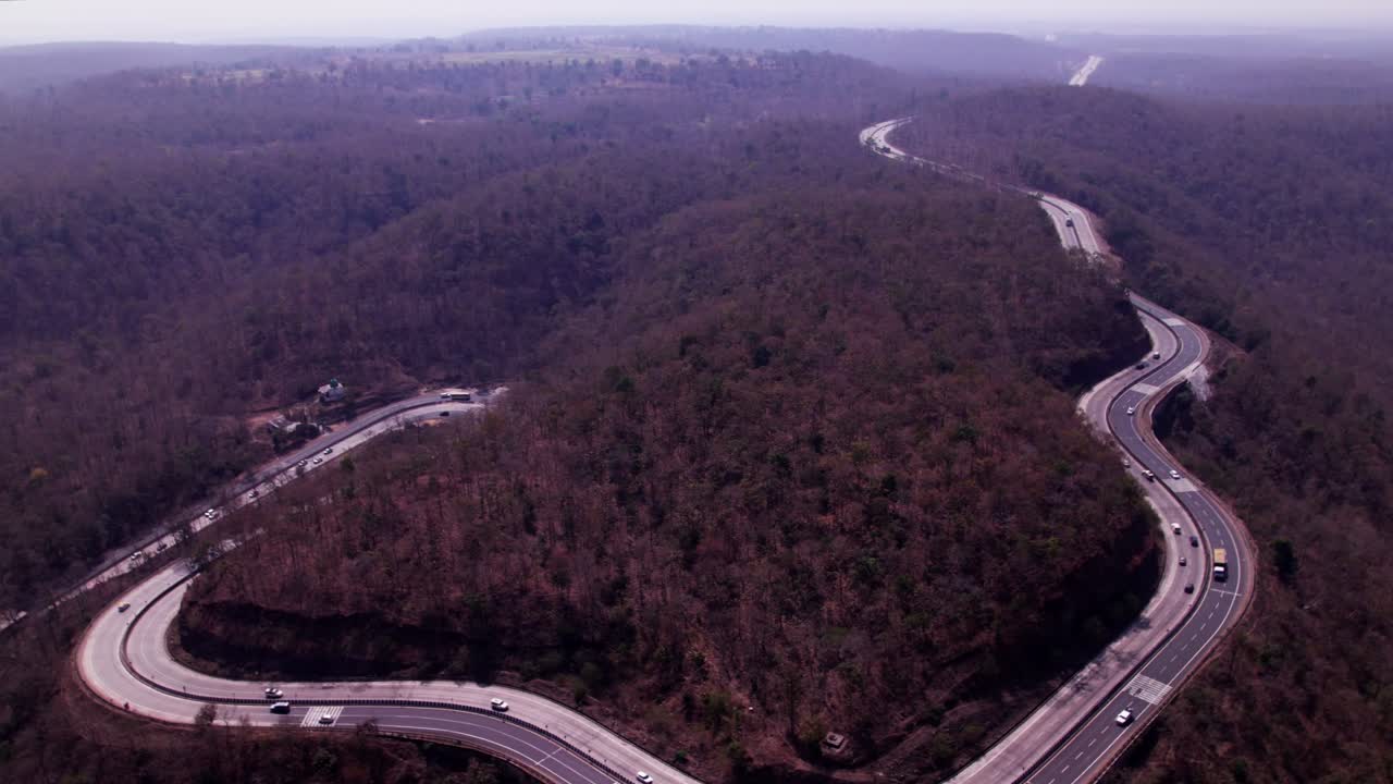 madhya pradesh forest area with ghat road and haze at day time, push in, drone shot, 4k.