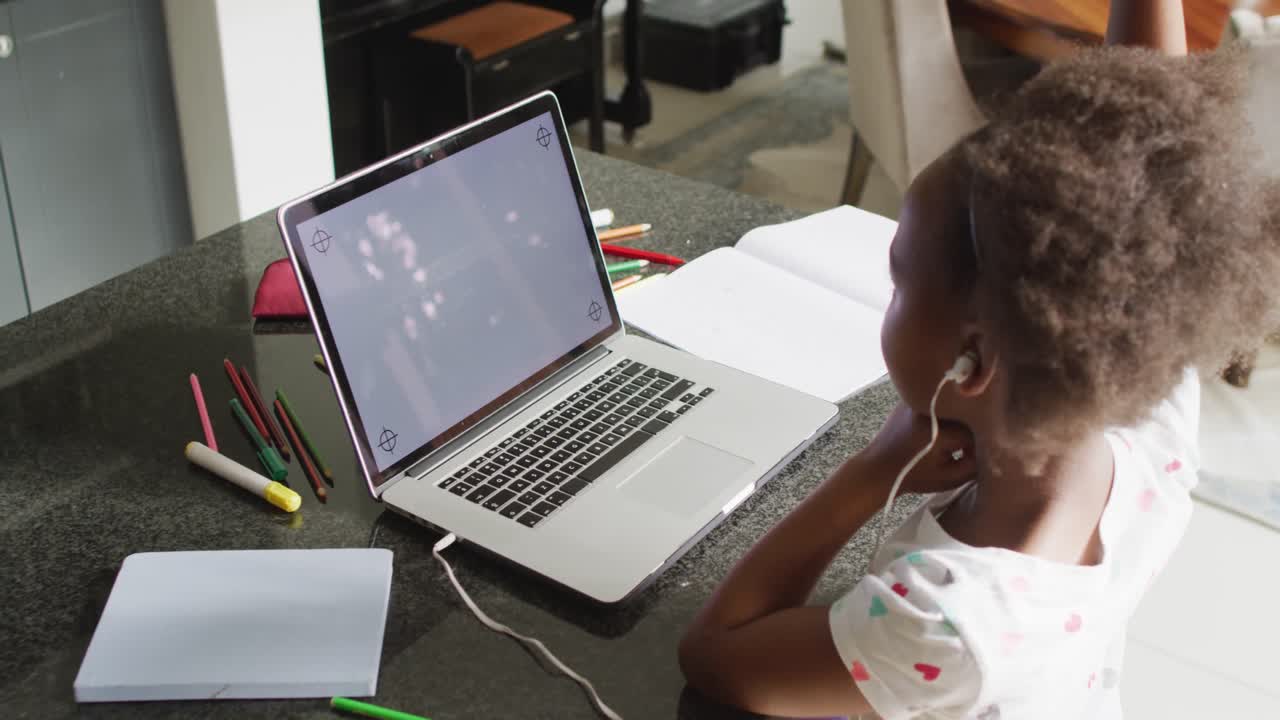 Video of african american girl using laptop with copy space